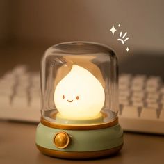 a cute little light sitting on top of a desk