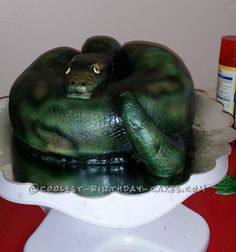 there is a cake that looks like a large green monster