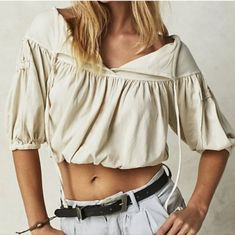 This Free People Top Has A Classic Silhouette With Modern Touches Like A Tie Detail And Pleating For Added Dimension. Perfect For Effortless Style, Its Cropped Fit And Optic White Color Keep You On Trend. Machine Wash Cold 100% Cotton New Without Tags Beige Cotton V-neck Crop Top, Spring Beige Cotton Crop Top, Cream Bohemian Tops For Summer, Beige Cotton Crop Top For Spring, Cream Cotton Vacation Tops, Summer Cream Blouse With Relaxed Fit, Beige Long Sleeve Summer Crop Top, Summer Cream Blouse Relaxed Fit, Summer Cream Cotton Crop Top