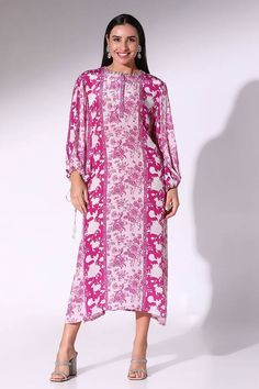 Plum tunic dress with floral print and a buttoned placket.
Components: 1
Pattern: Printed
Type Of Work: Floral
Neckline: Round
Sleeve Type: Balloon
Fabric: Crepe
Color: Purple
Occasion: Resort - Aza Fashions Floral Print Long Sleeve Kaftan For Eid, Long Sleeve Floral Print Kaftan For Eid, Patterned Floral Print Long Sleeve Kaftan, Long Sleeve Patterned Kaftan With Floral Print, Patterned Long Sleeve Floral Kaftan, Long Sleeve Floral Print Patterned Kaftan, Floral Print Dress For Eid Vacation, Floral Print Vacation Dress For Eid, Floral Print Long Sleeve Kaftan For Daywear