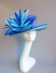 Made with pure love this sinamay hat in kingfiher and royal blue with ton sur ton grinn adorment siz Unique Blue Adjustable Hat, Unique Adjustable Blue Hat, Blue Sinamay Fascinator For Party, Blue Sinamay Party Fascinator, Fitted Blue Brimmed Top Hat, Blue Sinamay Hat For Summer, Blue Sinamay Hat For Party, Blue Handmade Hats For Kentucky Derby, Blue Sinamay Fascinator For Kentucky Derby