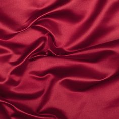 Mood's Premium Roja Red Silk Duchesse Satin is as regal as silk fabric gets. Its riveting understated sheen, medium weight and firm hand make for elegant special occasion wear. Available in 25+ attractive shades. 

Note: Dye lots are subject to change up to 10% in either direction. Ordering swatches is HIGHLY recommended for these products. Red Satin Fabric, Satin Curtains, Satin Suit, Duchess Satin, Mood Fabrics, Satin Saree, Luxury Silk, Silk Charmeuse, Stretch Satin