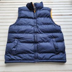 Nwot Fourcast Mens Puffer Vest Jacket Navy Blue Yellow Full Zip Sz M Co6 Weatherproof Blue Outerwear For Streetwear, Blue Weatherproof Sports Outerwear, Casual Blue Vest For Winter, Blue Winter Vest For Outdoor Activities, Blue Vest For Outdoor Winter Activities, Blue Sporty Outdoor Vest, Blue Sporty Vest For Outdoor, Yellow Weatherproof Winter Outerwear, Winter Weatherproof Yellow Outerwear