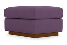 a large purple ottoman sitting on top of a wooden base