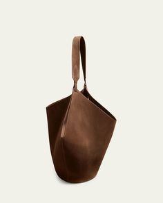 Khaite "Lotus" tote bag in calfskin suede and leather     Shoulder strap     Open top     Interior, leashed zip pouch     Approx. 8.5"H x 22"W x 15.5"D    Made in Italy Suede Tote Bag, Black Honey, Suede Tote, Medium Tote, Small Tote, Zip Pouch, Leather Pouch, Open Top, Black Tote Bag