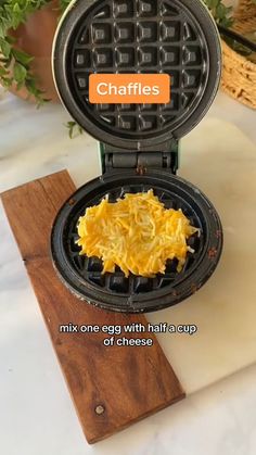 a waffle iron with some food inside of it