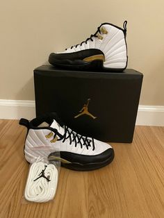 Nike Air Jordan 12 Royalty Taxi GS Black/White/Gold 153265-170 Size 4Y In hand ready to ship. Jordan 12’s, Jordan 12 Royalty, Jordan 12 White, Jordan 12 Taxi, Jordan 12 Black, Jordan 12s, Nike Shoes Women Fashion, Jordans Nike, Jordan 4’s