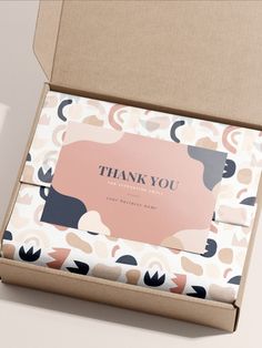 an open box with thank you cards inside