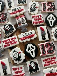 decorated cookies are arranged in the shape of letters and numbers for halloween themed birthdays