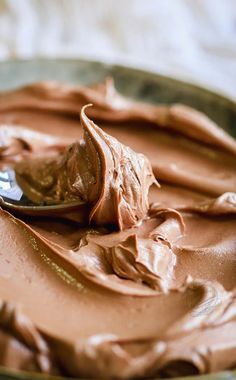 a spoon with some chocolate frosting on it