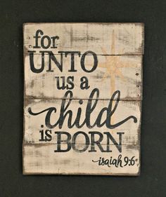 a wooden sign that says for unto us a child is born