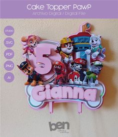 a cake topper with the number five surrounded by paw patrol and other cartoon characters