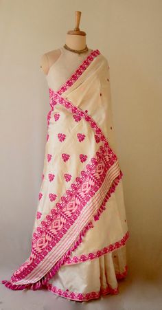 Handloom Silk Saree  from the looms of Assam, India. The saree has Tassar silk in the warp and Mulberry Silk in the  weft . Mulberry Silk is also known as Paat Silk in Assam. The motifs have been woven in acrylic and cotton. The light golden colour is due to the presence of tassar silk which naturally comes in light golden brown to off white . The design and colour schemes are very traditional and the saree can be worn in all kinds of occasions and functions.  It has a soft hand feel due to mulb Luxury Cotton Silk Saree With Gota Work, Luxury Semi-stitched Cotton Silk Saree, Pohela Boishakh Saree, Festival Pre-draped Chanderi Saree With Woven Motifs, Traditional Pre-draped Saree With Woven Motifs For Diwali, Festive Pre-draped Saree With Weaving Work, Transitional Bollywood Blouse Piece With Woven Motifs, Diwali Raw Silk Pre-draped Saree With Weaving Work, White Dupatta With Woven Motifs For Transitional Season