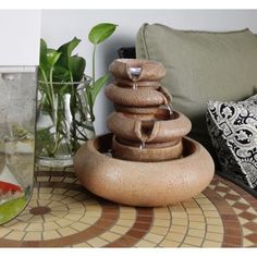 a water fountain sitting on top of a table