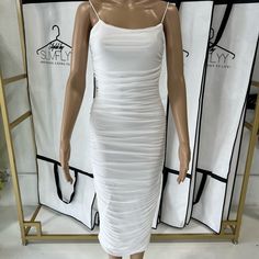 Color: White White Mesh Bodycon Dress With Ruching Detail. This Material Will Definitely Hug All Of You Curves While Cinching You At The Same Time. White Ruched Sheath Bodycon Dress, White Ruched Midi Bodycon Dress, White Ruched Sheath Midi Dress, White Ruched Midi Dress For Night Out, White Bodycon Dress With Spaghetti Straps For Brunch, White Spaghetti Strap Bodycon Dress For Brunch, White Ruched Sheath Mini Dress, White Bodycon Midi Dress For Brunch, Dress With Ruching