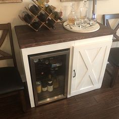 a wine rack with bottles and glasses on it