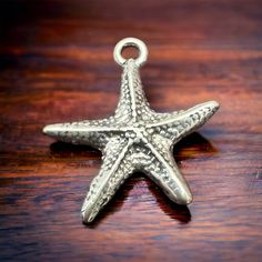 Sterling Starfish pendant/charm With this stunning, intricately designed product, you can enhance any charm bracelet or outfit and express your love for the ocean. Starfish Charms Jewelry As Gift, Starfish Charm Necklace As Gift, Starfish Charms Jewelry For Gift, Starfish Charms Jewelry For Gifts, Starfish Charms Jewelry As A Gift, Starfish Charm Necklaces For Gifts, Starfish Charm Necklaces As Gift, Starfish Charm Necklace Perfect For Gifts, Ocean-inspired Jewelry With Star Charm