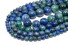 blue and green marble beads on a white background