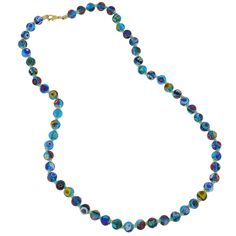 Add a touch of classic Venetian style to your outfit with this elegant Murano millefiori necklace. Centuries-old Murano glass technique perfected by Italian master craftsmen is used to create colorful mosaic effect that is fun and trendy, yet classic and timeless. This is a unique necklace that will add Venetian chic to your jewelry collection and will brighten up your look and your day. Measurements: Each necklace measures 24 inches in length and comes with an attractive velvet pouch and a cert Elegant Multicolor Czech Glass Necklaces, Elegant Turquoise Glass Beaded Necklace, Blue Round Glass Beaded Necklace, Single Strand Murano Glass Necklaces With Round Beads, Turquoise Single Strand Glass Necklace, Elegant Multicolor Glass Necklaces, Turquoise Round Glass Necklaces, Blue Glass Round Necklaces, Elegant Blue Glass Necklaces