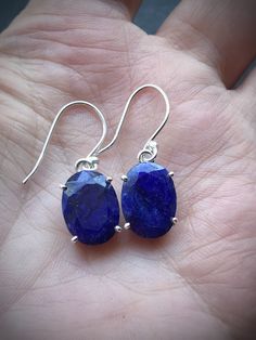 "Gorgeous genuine Sapphire handcrafted earrings in 925 solid sterling silver, the full length is about 1.22\". ✓You'll receive your new earrings with the gift box ✓ Genuine Sapphire ✓Because of the natural crystal structure, natural gemstones could have some small visible scars and crackles ✓ Solid 925 Sterling Silver (925 parts per 1000) ✓ Silver Hallmark on every item ✓ Due to unique shape of the main stone the earrings are slightly different in length Blue sapphire can be used to help ease he Oval Sterling Silver Gemstones As Gifts, Elegant Faceted Gemstones In Sterling Silver, Sapphire Earrings For Gifts, Sapphire Gemstones In Sterling Silver, Elegant Handmade Sterling Silver Gemstones, Oval Faceted Earrings As Gift, Classic Sterling Silver Earrings For Her, Classic Sterling Silver Earrings As Gift For Her, Formal Faceted Sterling Silver Jewelry