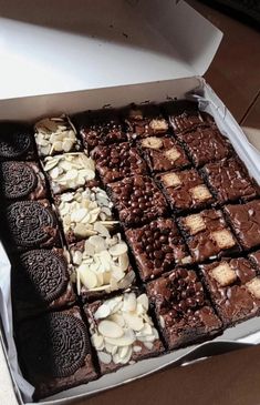 a box filled with lots of brownies and cookies