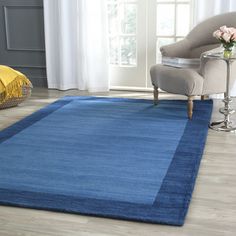 a blue area rug in a living room