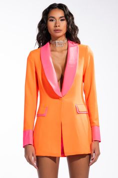 Love like a sunset. the akira label sunsets in miami neon fitted blazer features a lightweight blazer fabrication, a two-tone design, a contrast lapel collar, padded shoulders, princess seam detailing, long contrast cuff sleeves, mock flap front dual pockets, and a single front button closure. pair with the coordinating sunset in miami neon shorts for your next night out!- shell: 97% polyester 3% spandex, lining: 100% polyester(all measurements approximate from size small)- 30” shoulder to hem- Fitted Orange Outerwear With Notch Lapel, Chic Orange Fitted Blazer, Chic Fitted Orange Blazer, Fitted Orange Blazer With Long Sleeves, Fitted Orange Outerwear For Summer, Fitted Blazer With Contrast Trim For Work, Formal Fitted Outerwear With Contrast Trim, Fitted Blazer With Contrast Trim For Office, Spring Workwear Blazer With Contrast Trim