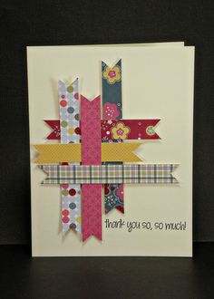 a handmade card with ribbons on it