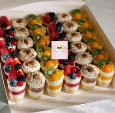 a box filled with lots of different types of desserts on top of each other