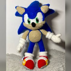 a crocheted sonic the hedge stuffed animal