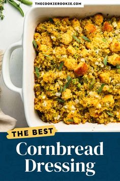 the best cornbread dressing recipe in a white casserole dish with fresh herbs on top