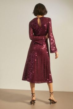 Meet your new occasionwear hero. Decorated with striking sequins, this midi dress shows off a waist-defining fit with balloon sleeves and a round neckline. Style with strappy heels and sparkling jewellery for a festive look. Model wears a size 10. Sparkly Midi Dress, Purple Sequin Dress, Dresses Sequin, Oasis Dress, Purple Midi Dress, Sequin Midi Dress, Dress With Sleeves, Festive Look, Oasis Fashion