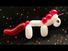 an inflatable balloon horse is on the ground with stars and sparkles around it