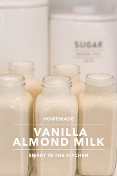 some jars are lined up next to each other with the words, homemade vanilla almond milk smart in the kitchen