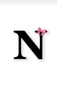 the letter n has a pink bow on it's head and is in black