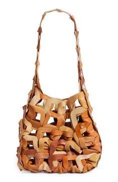 A meticulous web of interlaced circles made from scrap calfskin leather forms this one-of-a-kind signature tote that blurs the lines between art and accessory. Due to the handmade nature of the manufacturing process and the source materials, the exact color and pattern placement may vary with each piece. Open top Shoulder strap Handcrafted Unlined Leather Made in the USA SPACE: A shop for emerging and advanced designers Leather Hobo Bag With Interwoven Design For Everyday, Brown Shoulder Bag With Interwoven Design For Everyday Use, Brown Interwoven Shoulder Bag For Everyday Use, Leather Shoulder Bag With Interwoven Design For Everyday, Leather Bags With Interwoven Design For Everyday Use, Designer Leather Bags With Interwoven Design, Designer Natural Leather Shoulder Bag, Natural Leather Bag With Interwoven Design, Designer Brown Bags With Interwoven Design