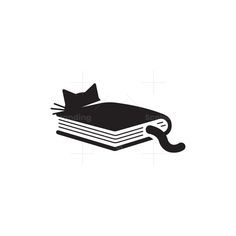 an open book with a cat on top