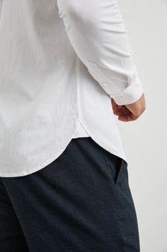 The ultimate white buttondown for year-round wear, the Kendrick shirt is an essential in every man's wardrobe. It's made from soft cotton poplin to keep you comfortable all day, and is easy to dress up or down for any occasion. 58% Rayon / 40% Cotton / 2% Spandex Everyday White Shirt With Placket, Classic Unstructured Shirt With Shirttail Hem, White Cotton Dress Shirt With Button Cuffs, Timeless White Cotton Dress Shirt, White Relaxed Fit Cotton Dress Shirt, Timeless Cotton Shirt For Daywear, White Classic Dress Shirt, Relaxed Fit, Classic White Dress Shirt Relaxed Fit, Classic White Relaxed Fit Dress Shirt