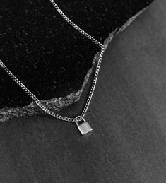 This stainless steel lock pendant necklace is fashionable yet subtle, offering a lasting sentiment without the risk of rust or tarnishing, even when worn in the water. 💎Free shipping on all orders💎Waterproof and non-tarnish💎Packaging that is ready to offer as a gift💎Customizable and adjustable chain length A silver lock necklace, a great gift for a special someone This lock necklace is favored by many and can make a thoughtful gift. It can symbolize different meanings such as love, protectio Minimalist Jewelry With Lock As A Gift, Minimalist Lock Jewelry As A Gift, Minimalist Lock Jewelry As Gift, Silver Tarnish Resistant Charm Necklace With Rectangular Pendant, Minimalist Everyday Jewelry With Lock Detail, Lock Necklace Men, Minimalist Lock Jewelry For Gifts, Everyday Silver Lock Jewelry, Lock Pendant Necklaces Men