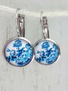 These are lovely white and blue flower, lever back earrings. Nickel, lead and cadmium free. Comes in a gift bag. Affordable Blue Round Flower Earrings, Cheap Blue Round Flower Earrings, Blue Flower Earrings, White And Blue Flowers, Blue Flower, Flower Earrings, Blue Flowers, Gift Bag, Favorite Jewelry