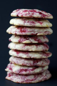 a stack of cranberry shortbread cookies sitting on top of a black table