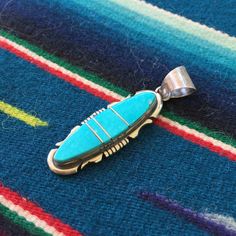 "Lovely inlaid turquoise gemstone and sterling silver hand crafted pendant by Native American Navajo artist Steve Francisco. Signed SF with sterling silver hallmark. 2 grams total (with chain) Pendant: 1.65\" tall, 0.45\" wide If you have questions about this item etc please ask before you purchase. Sold as-is, no returns on vintage items. All jewelry is sold as I receive it - I do not polish any silver pieces as many customers like the vintage patina - you can easily polish it to a high shine i Southwestern Sterling Silver Turquoise Necklace, Southwestern Silver Turquoise Inlay Necklace, Southwestern Engraved Turquoise Necklace In Sterling Silver, Artisan Turquoise Necklace With Inlay, Southwestern Turquoise Inlay Pendant Necklace, Unique Silver Turquoise Necklace With Inlay, Southwestern Turquoise Inlay Necklace, Artisan Turquoise Pendant Necklace With Inlay, Unique Sterling Silver Turquoise Inlay Necklace