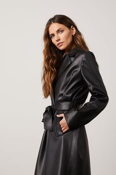 The versatile vegan leather trench coat that is simultaneously timeless with modern besom pockets and belted closure. The Freya has the ‘it-girl‘ stamp of approval. 100% Vegan Leather Belted Leather Long Coat For Business, Belted Leather Long Coat Jacket For Business, Belted Long Leather Jacket For Business, Sleek Leather Belted Outerwear, Classic Belted Long Leather Jacket, Classic Long Coat Leather Jacket With Belt, Classic Long Belted Leather Jacket, Chic Leather Outerwear With Belt, Chic Leather Jacket With Belt For Work