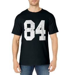 PRICES MAY VARY. Is 84 your favorite number? Win with this Great Sports Winning T-shirt for Kids Boys Girls Mom Dad Men Women Fans Football Basketball Baseball Ice Hockey or any other team sport. Wear it proudly to a game or to a 84 year old Birthday Novelty Jersey Costume Choose Perfect Gift for all day Sports Lovers Large #84 Bold Numbers Awesome Vector Design Christmas Halloween Sports Party Cool School College University Coaches Students Players 84 Coach Pick Commish Classic Subtle Distresse Jersey Costume, Cool School, Favorite Number, Sports Party, Sport Player, Sports Lover, Football And Basketball, College University, Too Cool For School