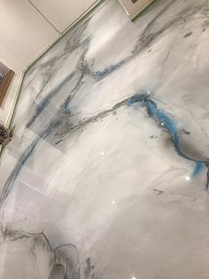 a marble floor with blue and white lines on it