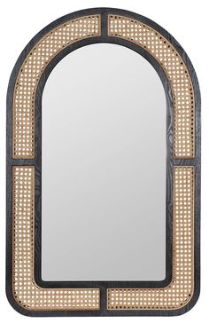 a decorative mirror with an arch shaped frame