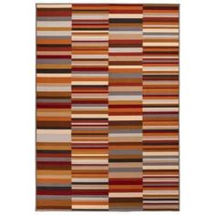 a multicolored rug with stripes on it