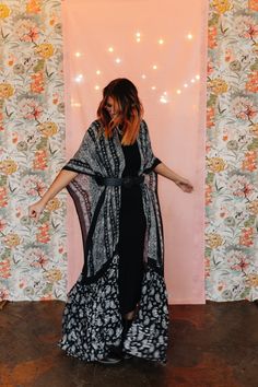 Behold the effortless elegance of our Free Flow Paisley Longline Kimono. With its expansive dimensions of 55" x 44" and a generous 24" armhole, this kimono is the epitome of breezy sophistication. The intricate paisley pattern infuses an aura of timeless style. Ideal for layering over a casual outfit or adding a dash of glamour to an evening ensemble, this kimono offers versatility and flair. Size : 55" x 44" 24" Arm Hole 100% Viscose Fitted Bohemian Wrap Kimono, Fitted Bohemian Kaftan With Kimono Sleeves, Black Flowy Bohemian Kimono, Fitted Printed Bohemian Kimono, Fitted Bohemian Printed Kimono, Bohemian Long Kimono With Paisley Print, Long Bohemian Kimono With Paisley Print, Long Paisley Print Kimono For Festivals, Black Flowy Kimono With Kimono Sleeves