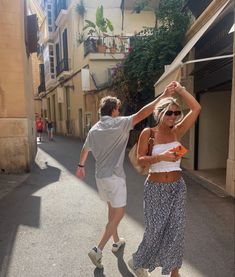 a man and woman dancing in the street