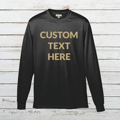 Add Your Own Text - Custom Personalized Wicking T-Shirt Polyester Long Sleeve Tee for Men Put any text you want onto a long sleeve polyester wicking tee shirt with the text color of your choice. Please make sure to look through all the photos for the options we have available. Make sure to include your custom options in the Add Your Personalization section before adding the item to your cart. - 100% polyester wicking knit - Self-fabric collar, double-needle cover-stitched collar and armholes - S Long Sleeve Moisture-wicking T-shirt For Sports, Custom Text Long Sleeve Tops For Streetwear, Black Long Sleeve T-shirt With Custom Text, Black Crew Neck Top With Custom Text, Black Long Sleeve Sports T-shirt, Black Long Sleeve T-shirt For Sports Events, Customizable Long Sleeve Sports T-shirt, Customizable Black Top With Text, Customizable Black Long Sleeve T-shirt